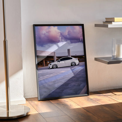 Subaru WRX parked under vibrant sunset sky poster wall art print in black frame.