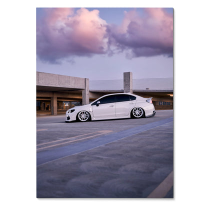 White Subaru WRX parked under purple and pink sunset sky poster wall art.