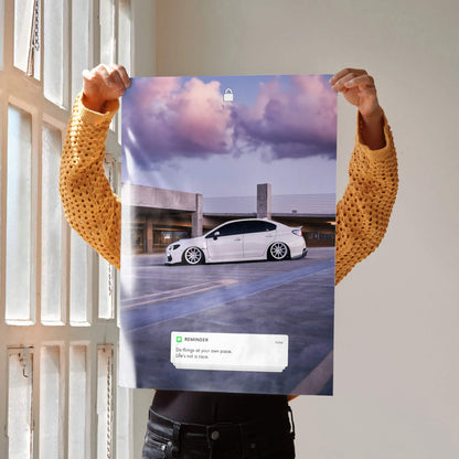 Poster wall art featuring a white Subaru WRX on a rooftop with a dramatic cloudy sky background and motivational text.