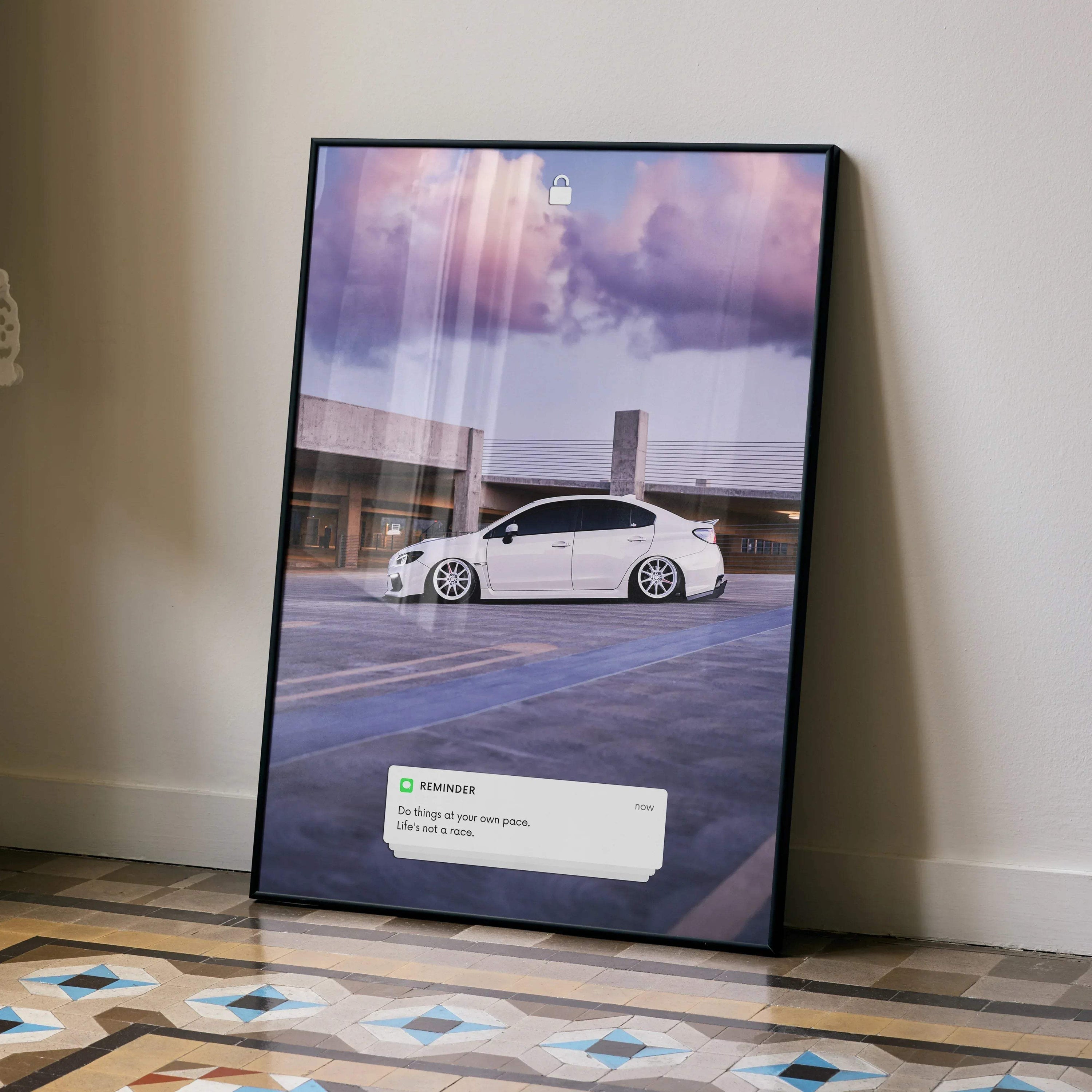 Subaru WRX motivational poster with inspiring text in black frame leaning on wall, wall art.