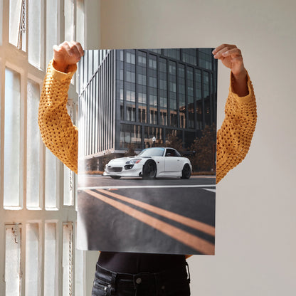 Honda S2000 poster wall art featuring white sports car in urban setting with glass building background.