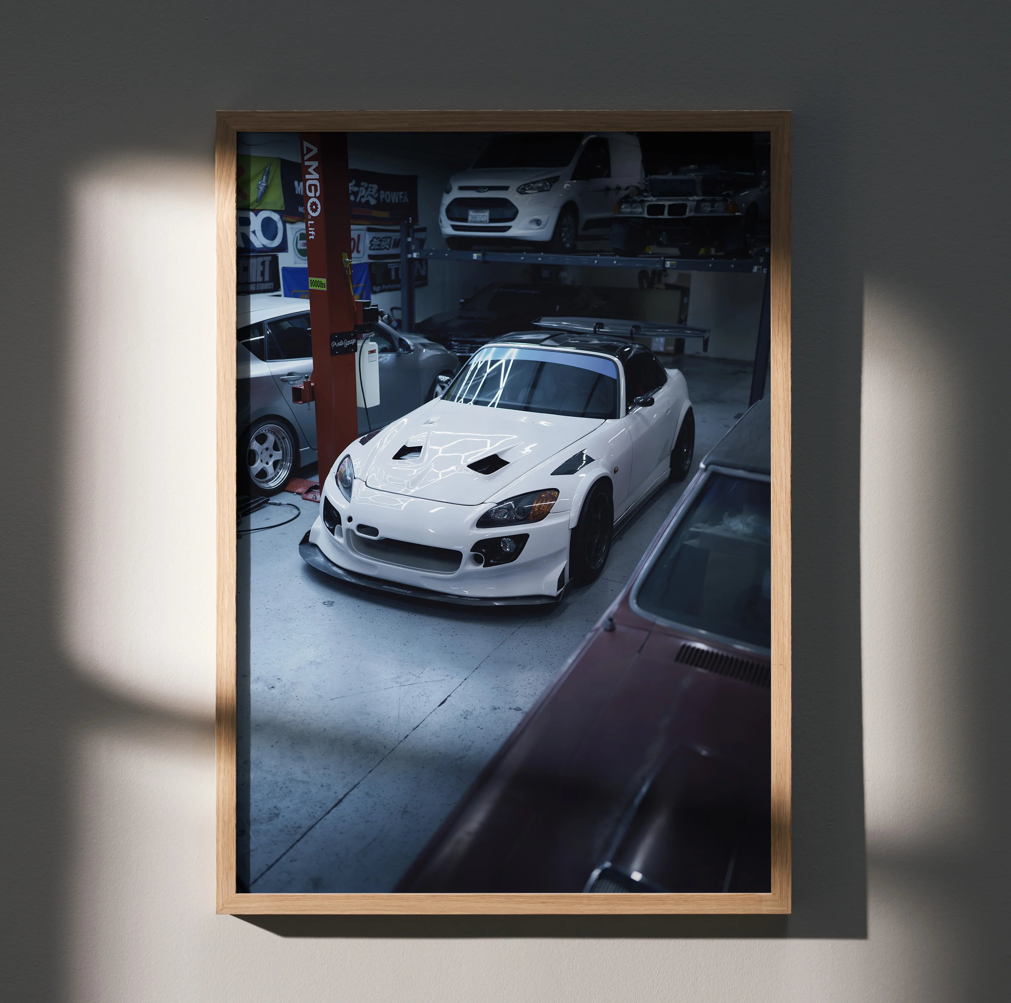 Honda S2000 poster featuring a white sports car in a garage, high-resolution wall art with moody lighting.