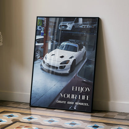 Honda S2000 poster wall art featuring a white sports car with motivational text on a reflective surface.