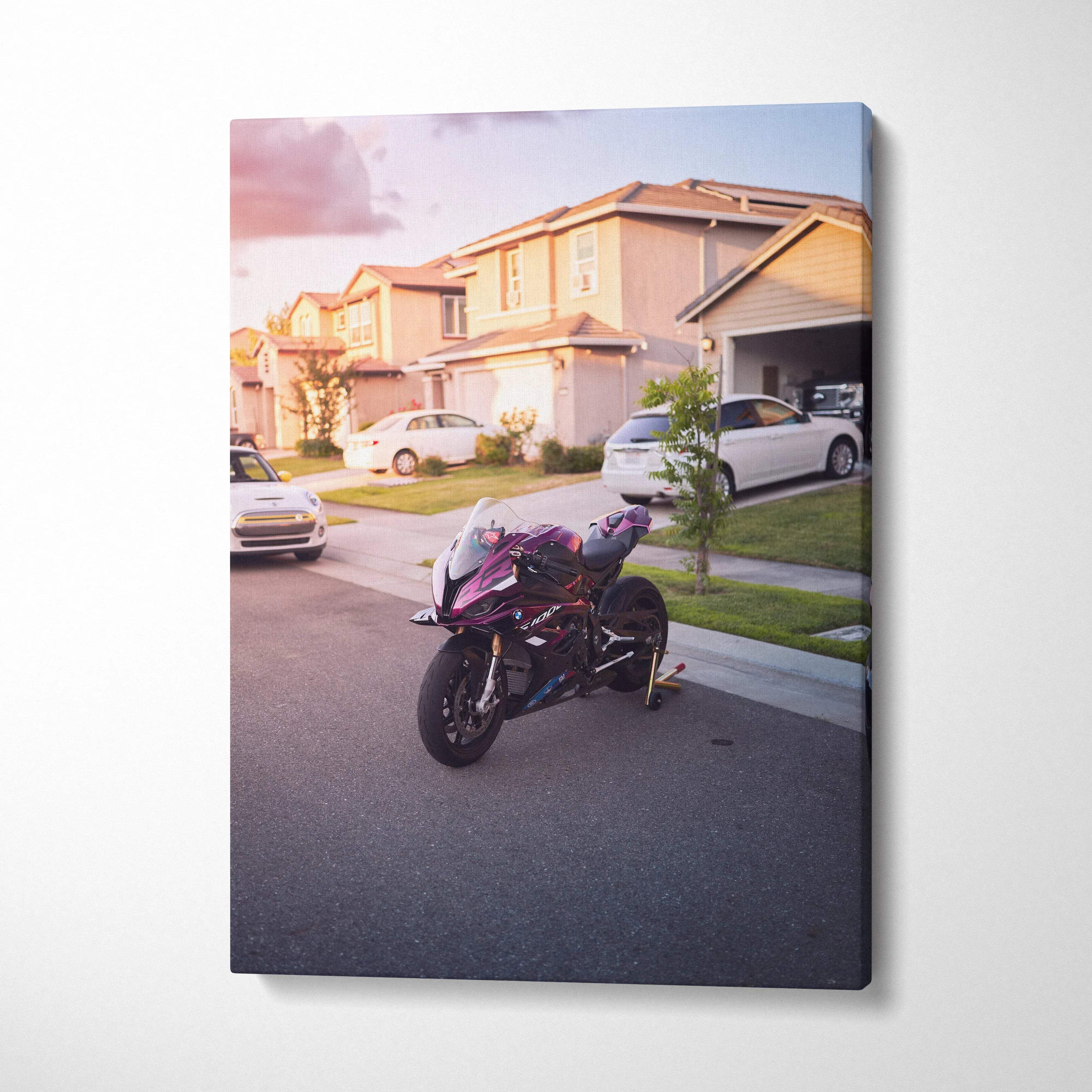 BMW S1000RR motorcycle parked on suburban street canvas wall art with warm sunset lighting.