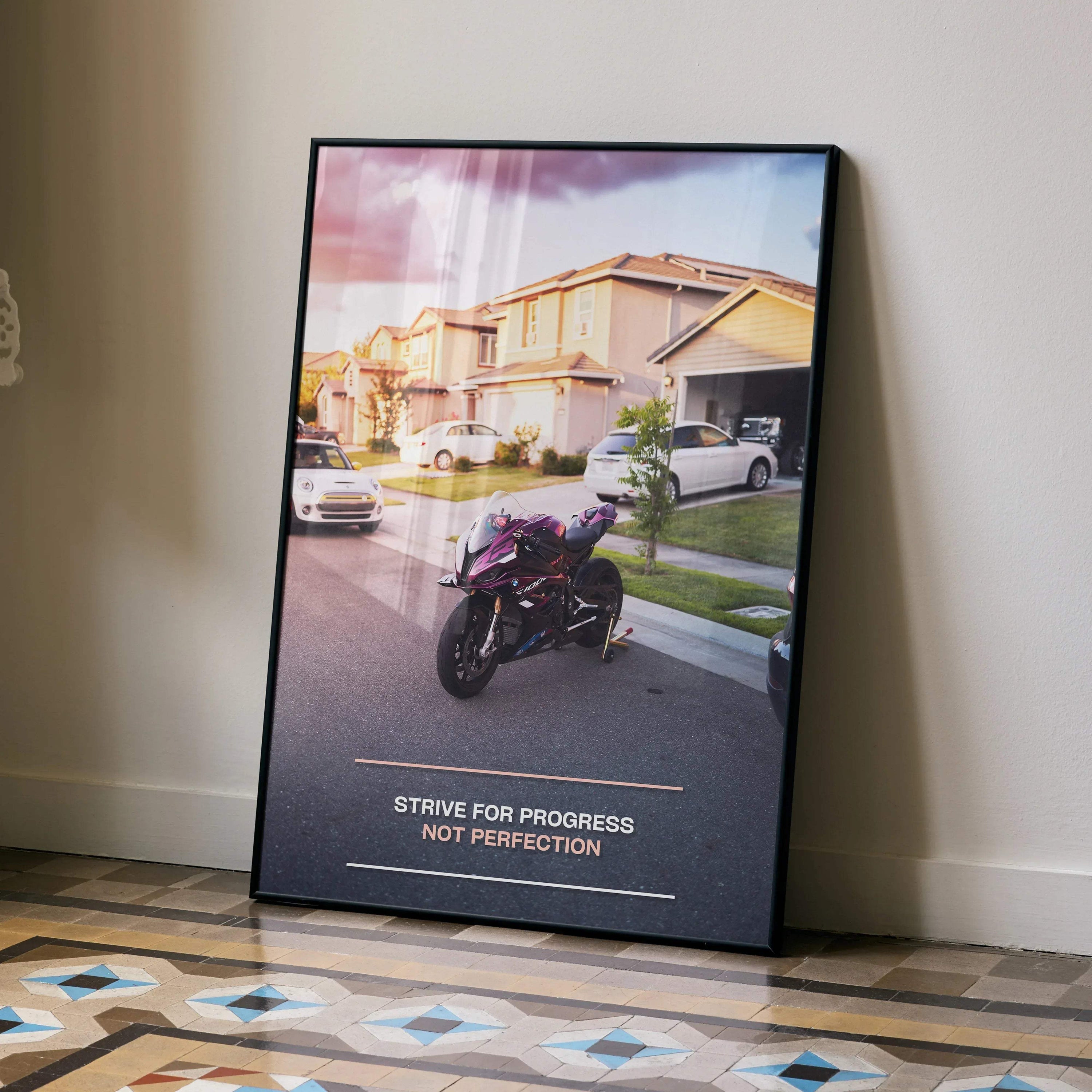 Motivational wall art poster featuring a BMW S1000RR motorcycle with inspiring text "Strive for progress not perfection" in.
