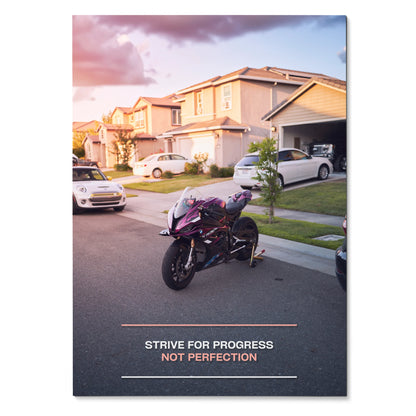 Motivational poster wall art featuring BMW S1000RR motorcycle with inspiring sunset neighborhood background and text "Strive .