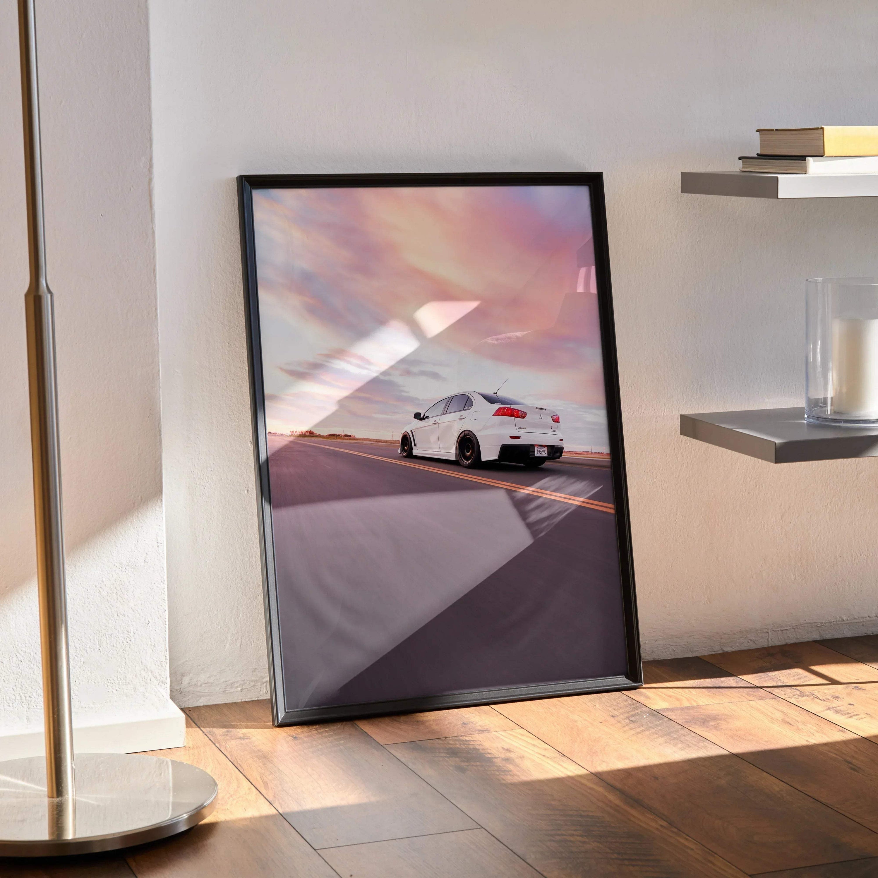 Mitsubishi Evo 10 poster wall art with white car driving at sunset and colorful sky.