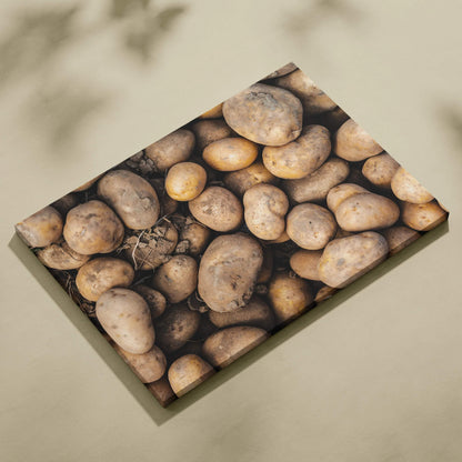 Rustic potato close-up on textured canvas wall art for kitchen decor.