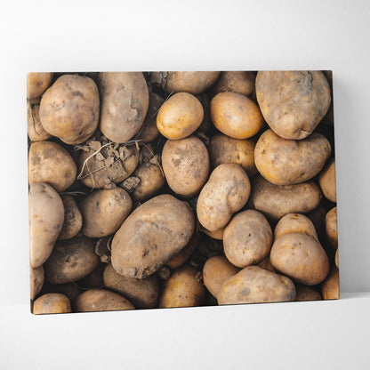 Rustic canvas wall art featuring a close-up of various brown potatoes for kitchen decor.