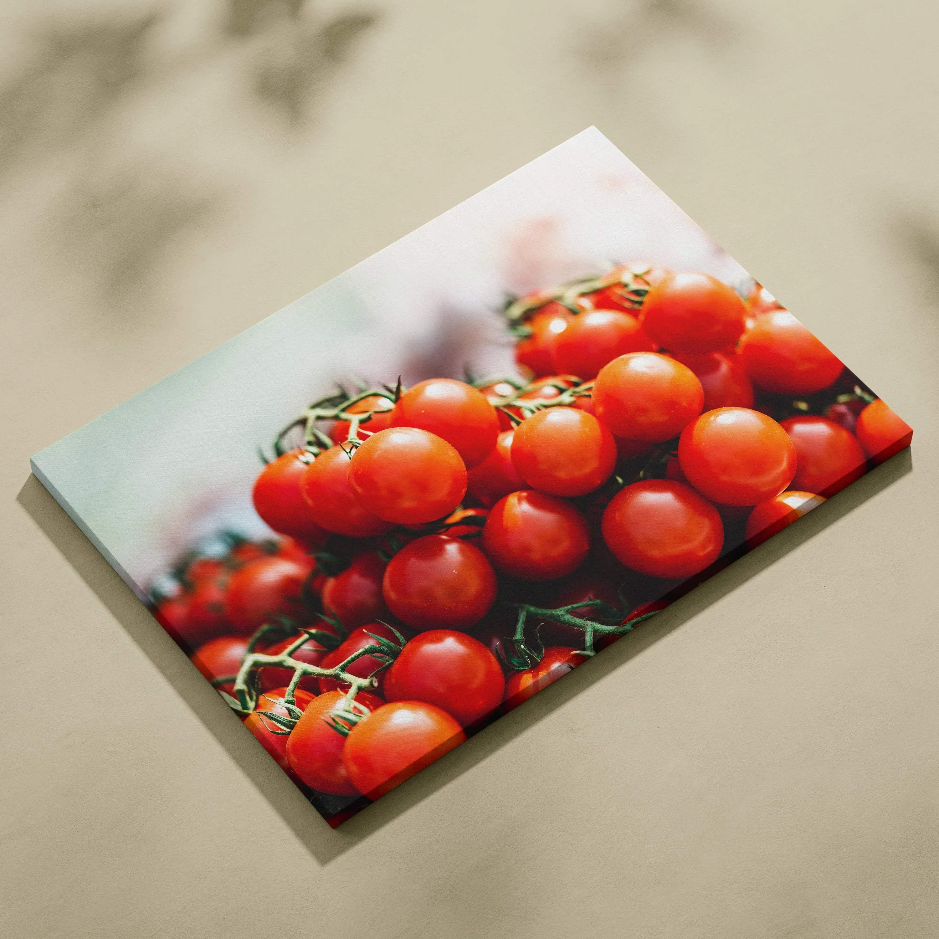 Canvas wall art featuring vibrant red cherry tomatoes clustered on green stems, ideal for kitchen decor.