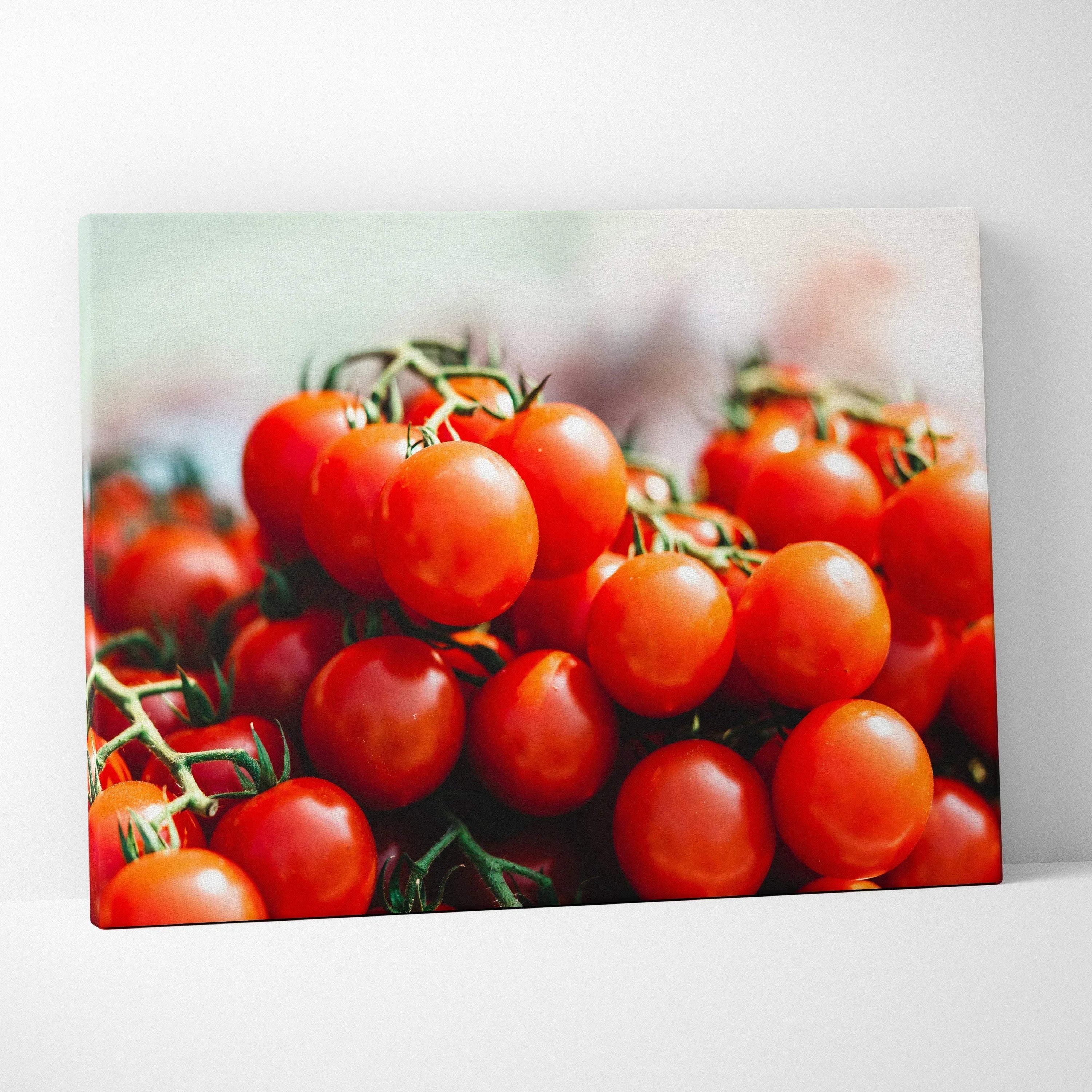 Vibrant tomato cluster close-up on canvas wall art with rich red and green tones for kitchen decor.