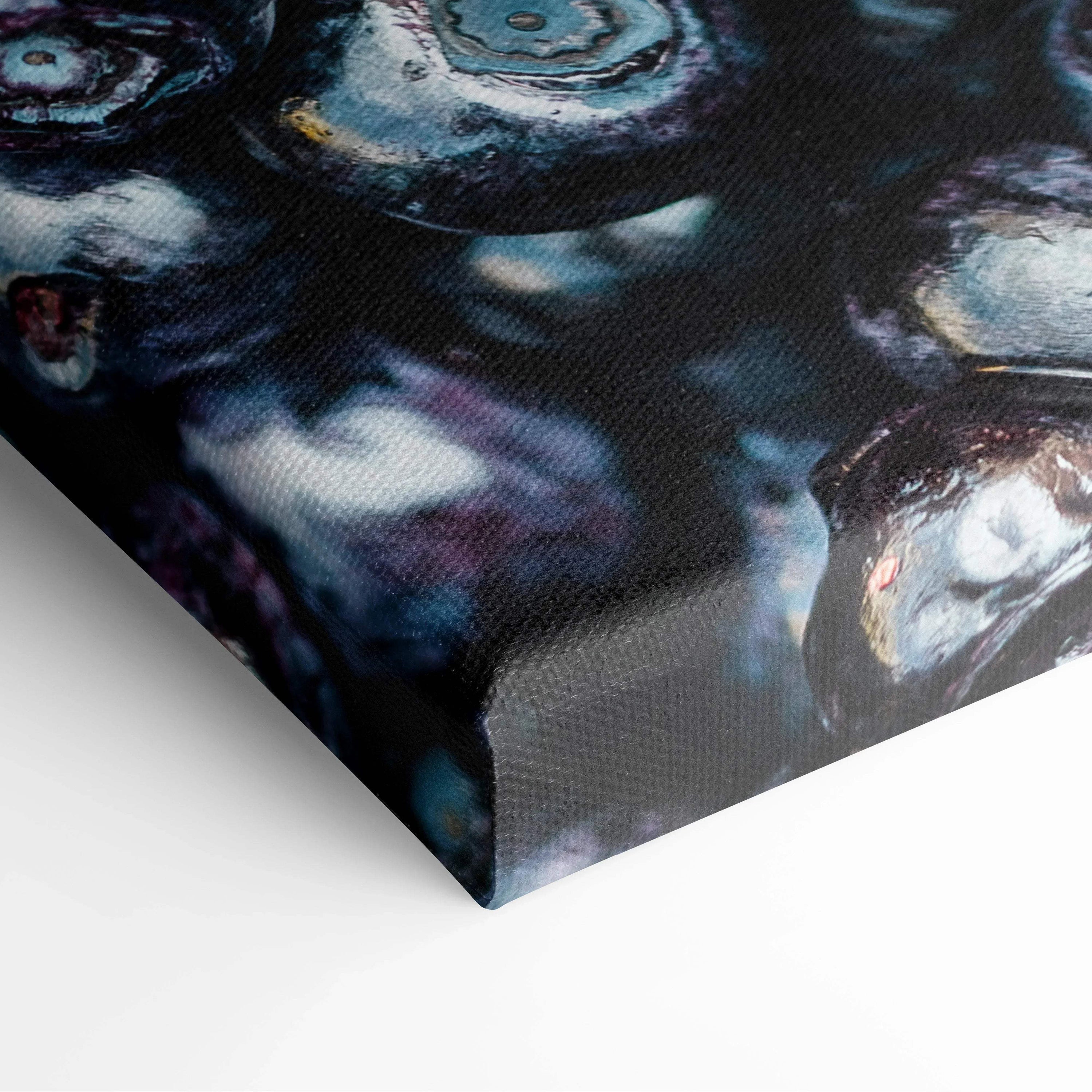 Close-up of vibrant blue and purple blueberries printed on textured canvas wall art with rich, deep colors and glossy.
