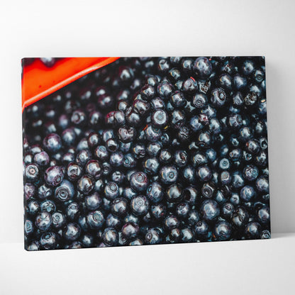 Vibrant blueberries close-up on canvas wall art with rich colors, perfect for home decor.