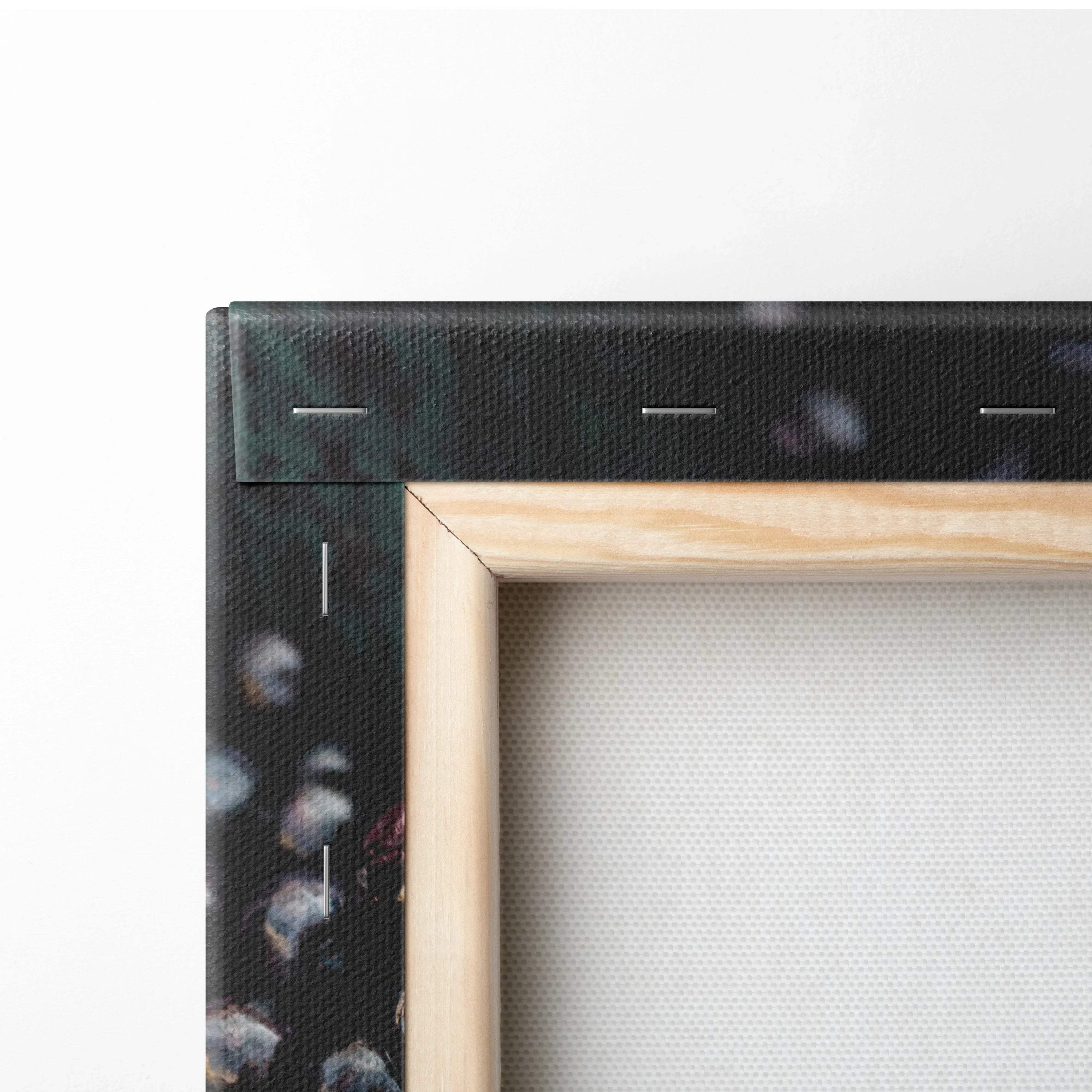 Close-up of wooden frame corner and black canvas backing with staples on vibrant blueberry canvas wall art decor.