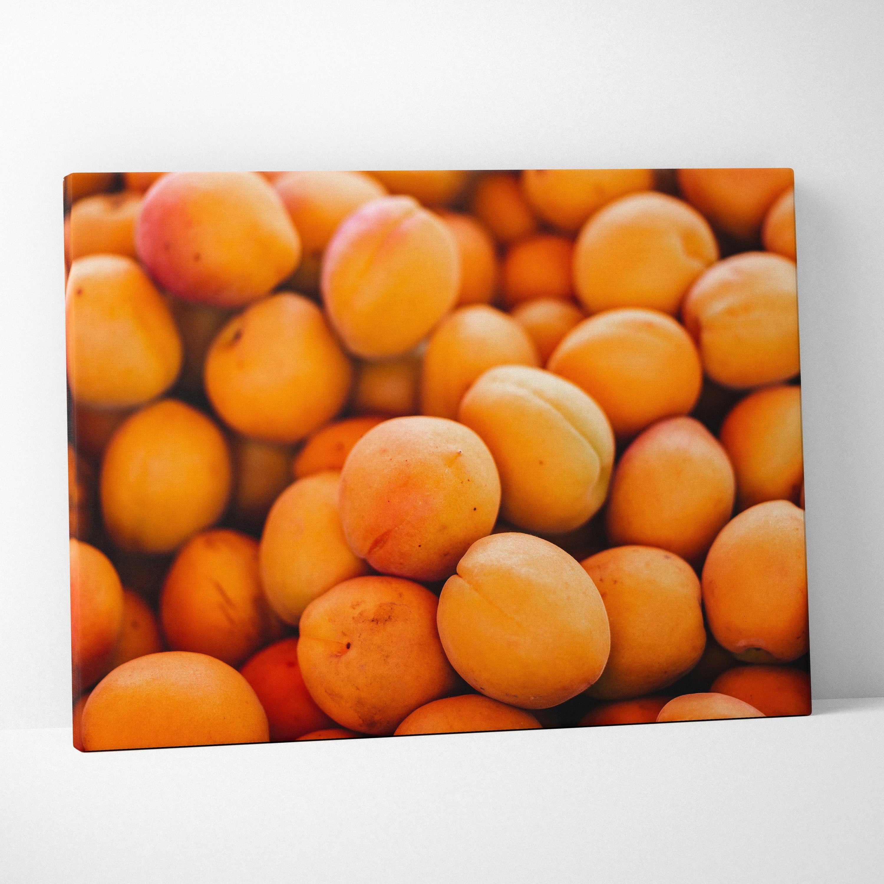 Vibrant canvas wall art featuring close-up of fresh, juicy peach fruits with rich orange hues and smooth texture.