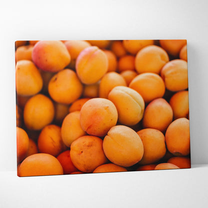 Vibrant canvas wall art featuring close-up of fresh, juicy peach fruits with rich orange hues and smooth texture.