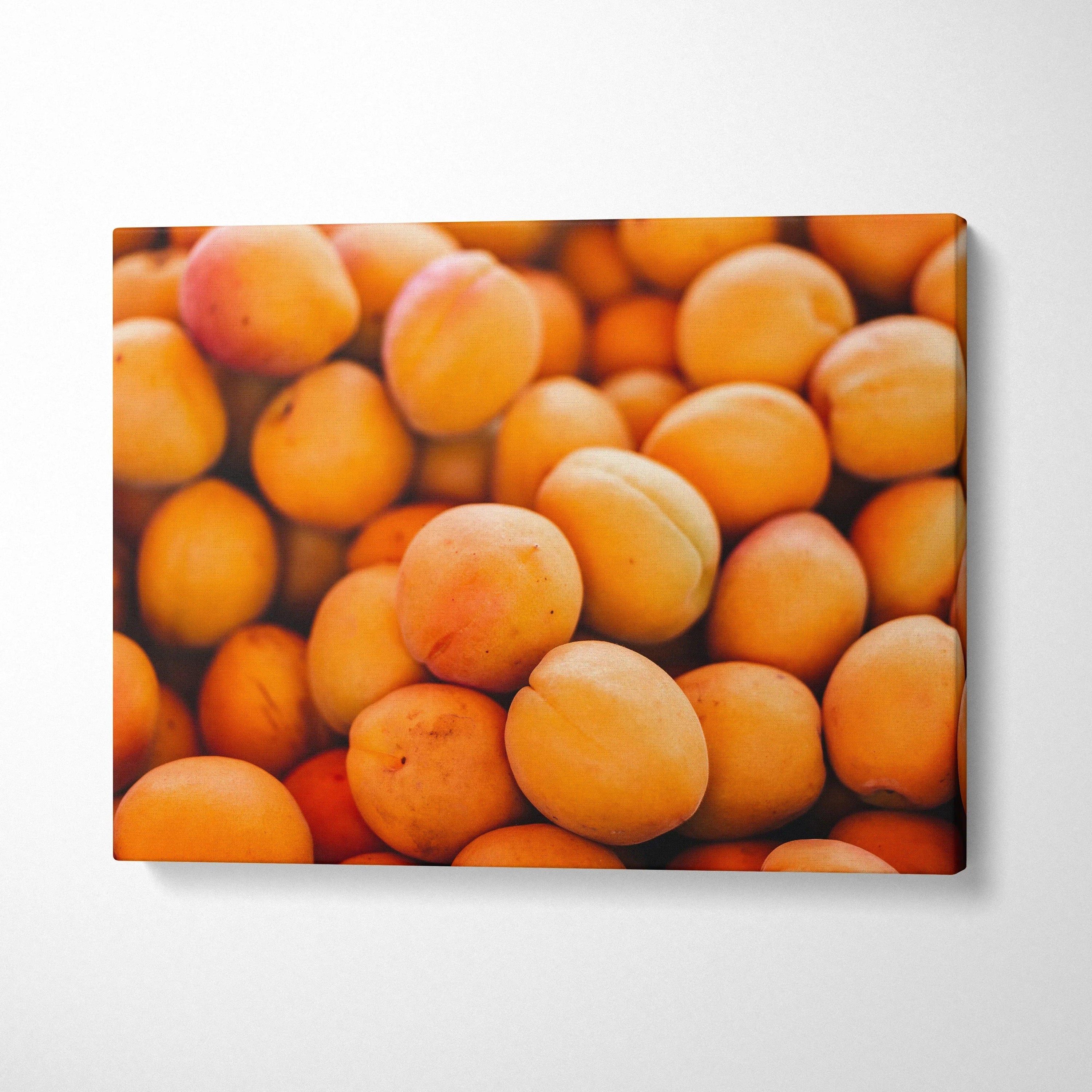 Vibrant peach fruit close-up on canvas wall art with rich orange tones for home decor.