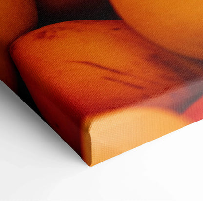 Close-up of vibrant peach-themed canvas wall art with rich orange tones for decor.