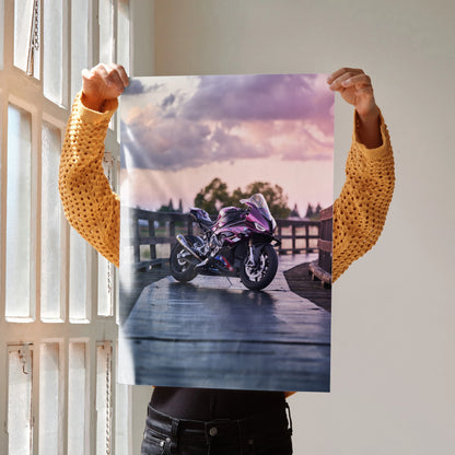 BMW S1000RR motorcycle parked on pier at sunset poster wall art with vibrant sky colors.