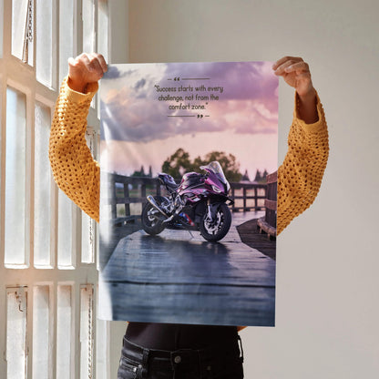 Motivational poster wall art featuring a BMW S1000RR motorcycle on a wooden deck with inspiring text and a pastel sunset sky.