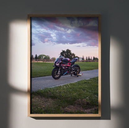BMW S1000RR motorcycle poster with dramatic sunset sky, premium wall art in wooden frame.