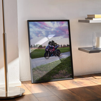 BMW S1000RR motorcycle poster leaning against wall with vibrant sky, premium wall art for motorcycle lovers.