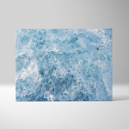 Blue and white swirling abstract canvas art wall decor with textured digital design.