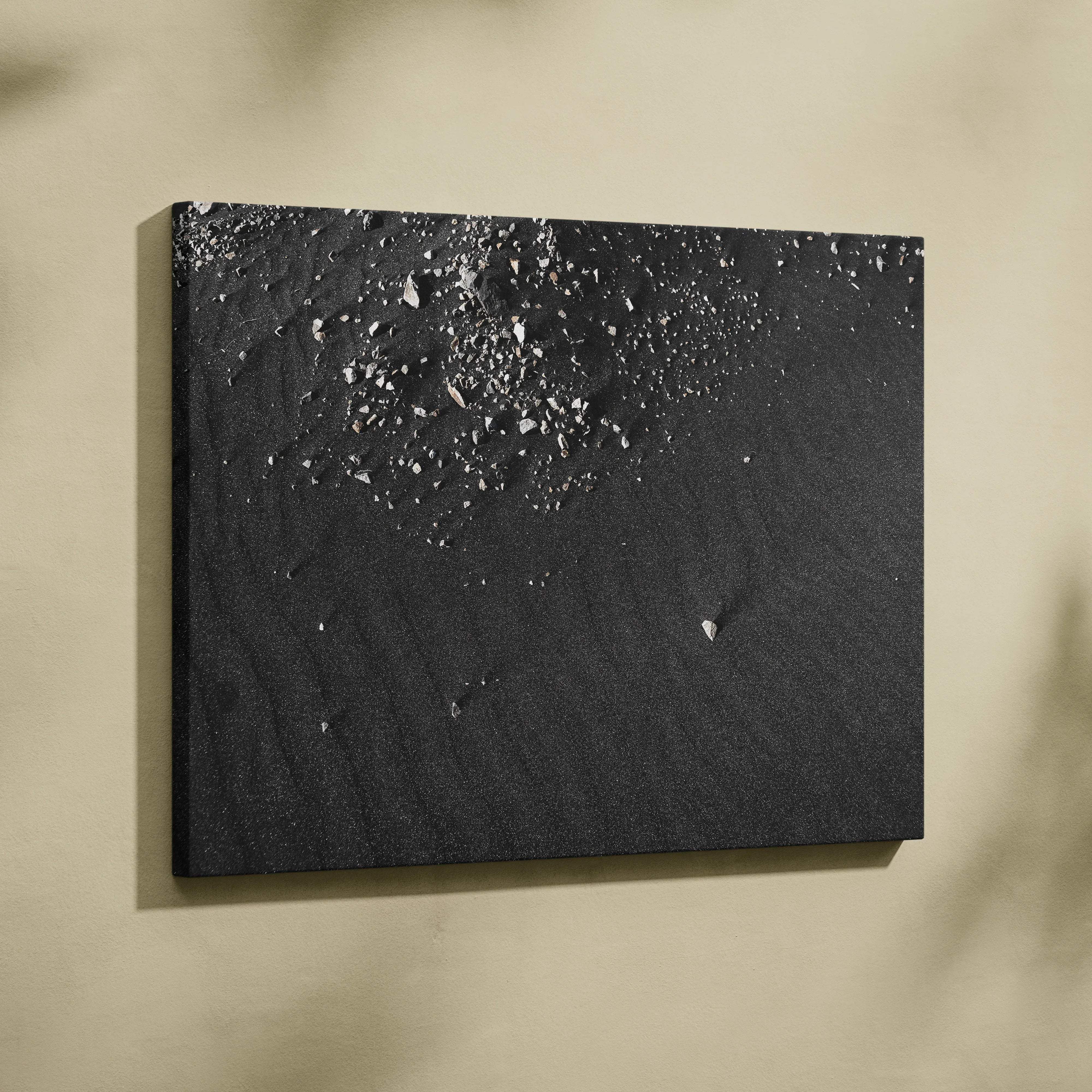 Black textured canvas wall art with scattered silver metallic fragments featuring black sand and pebble texture for modern decor
