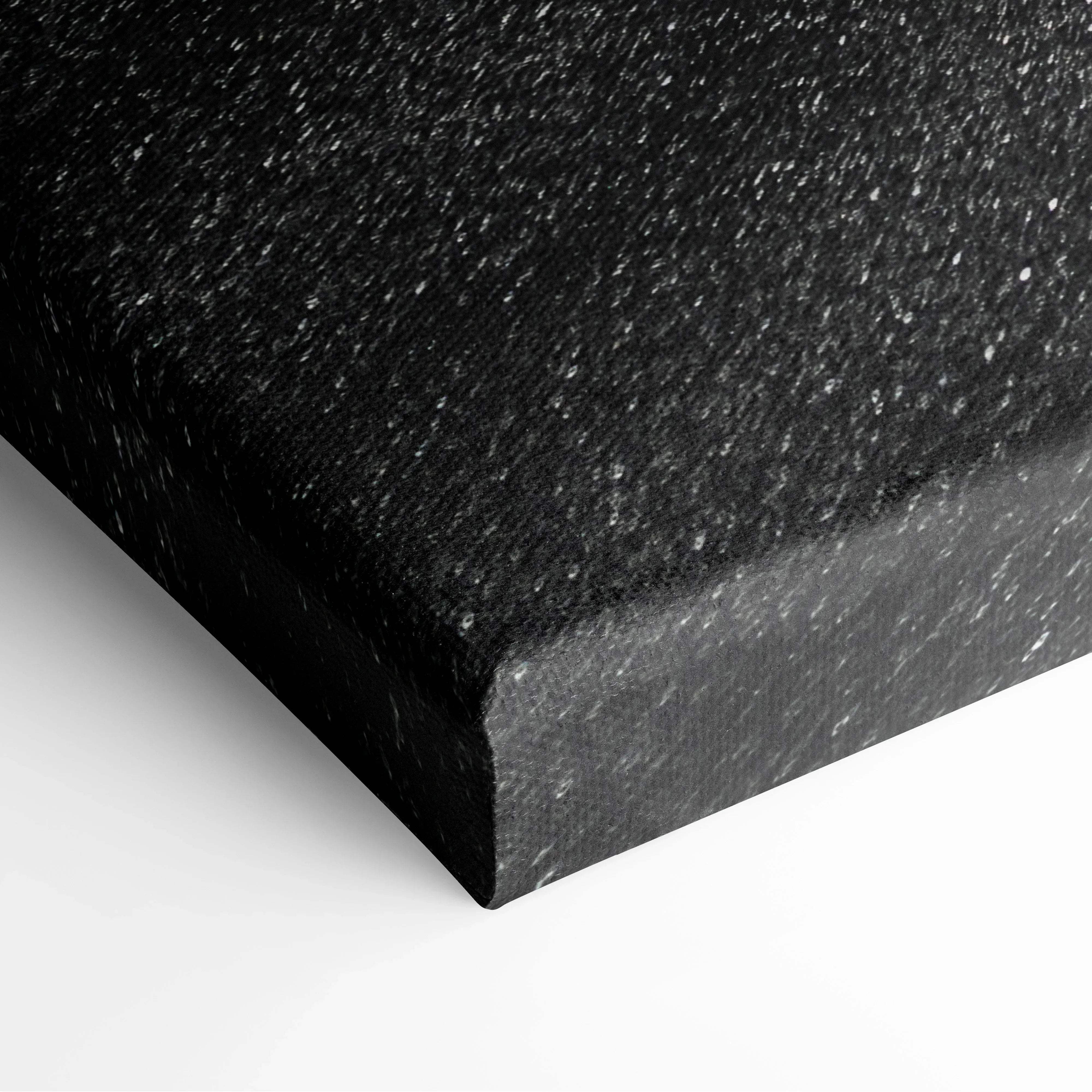 Abstract canvas wall art featuring black textured canvas with speckled matte finish and minimalist sand ripple design