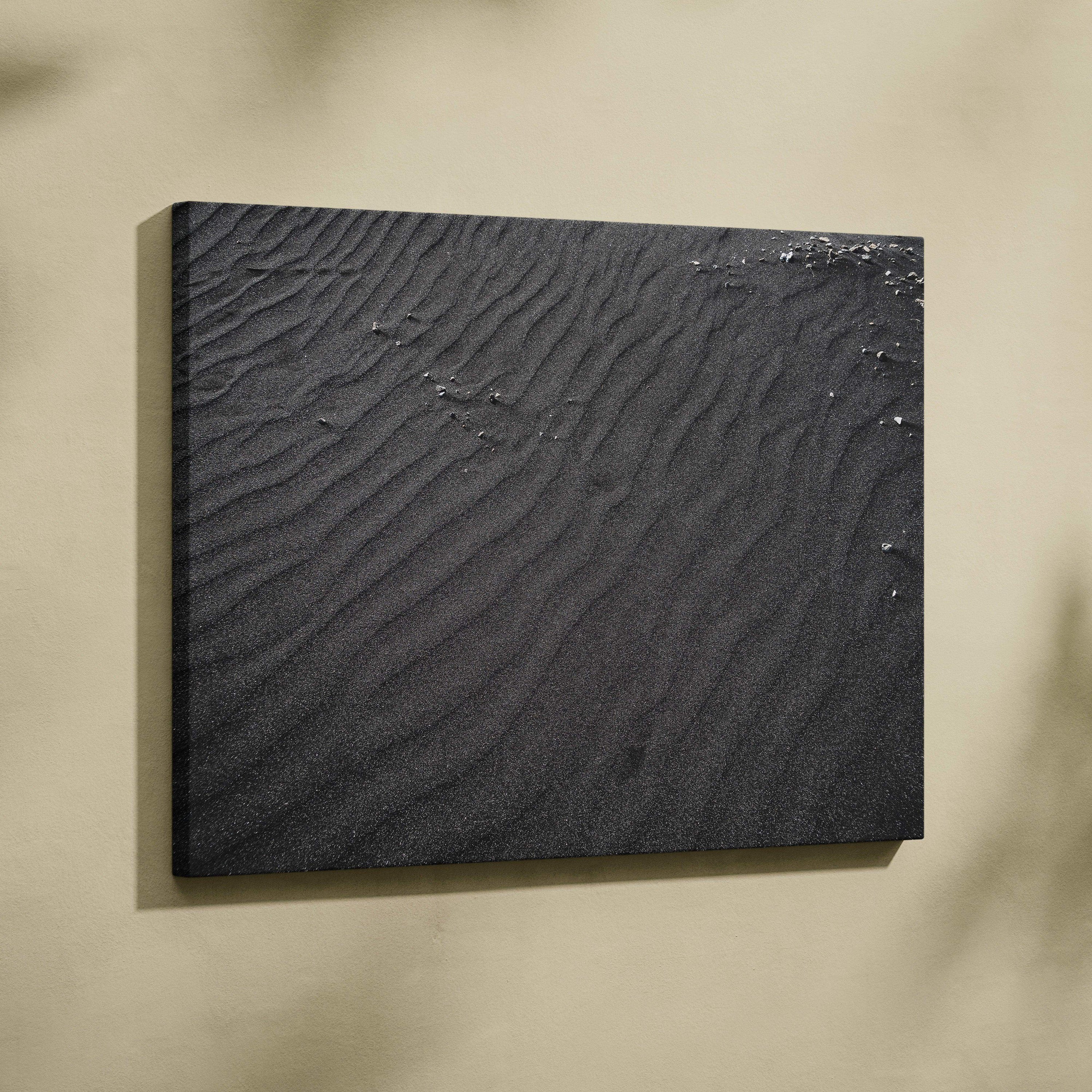 Black textured sand abstract canvas wall art with subtle ripple patterns and small scattered white accents.