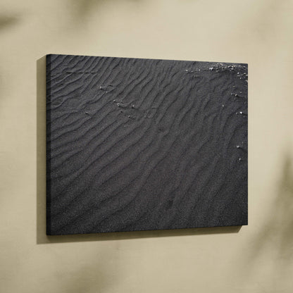 Black textured sand abstract canvas wall art with subtle ripple patterns and small scattered white accents.