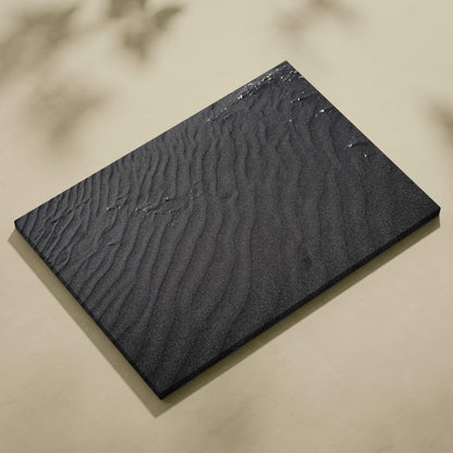 Black canvas wall art with textured, wavy abstract patterns and subtle raised details.