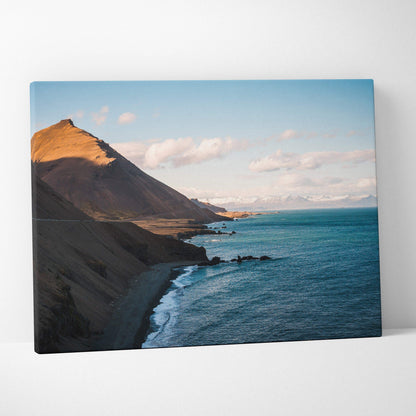Canvas wall art of Iceland coastline with golden sunlit cliffs and calm blues