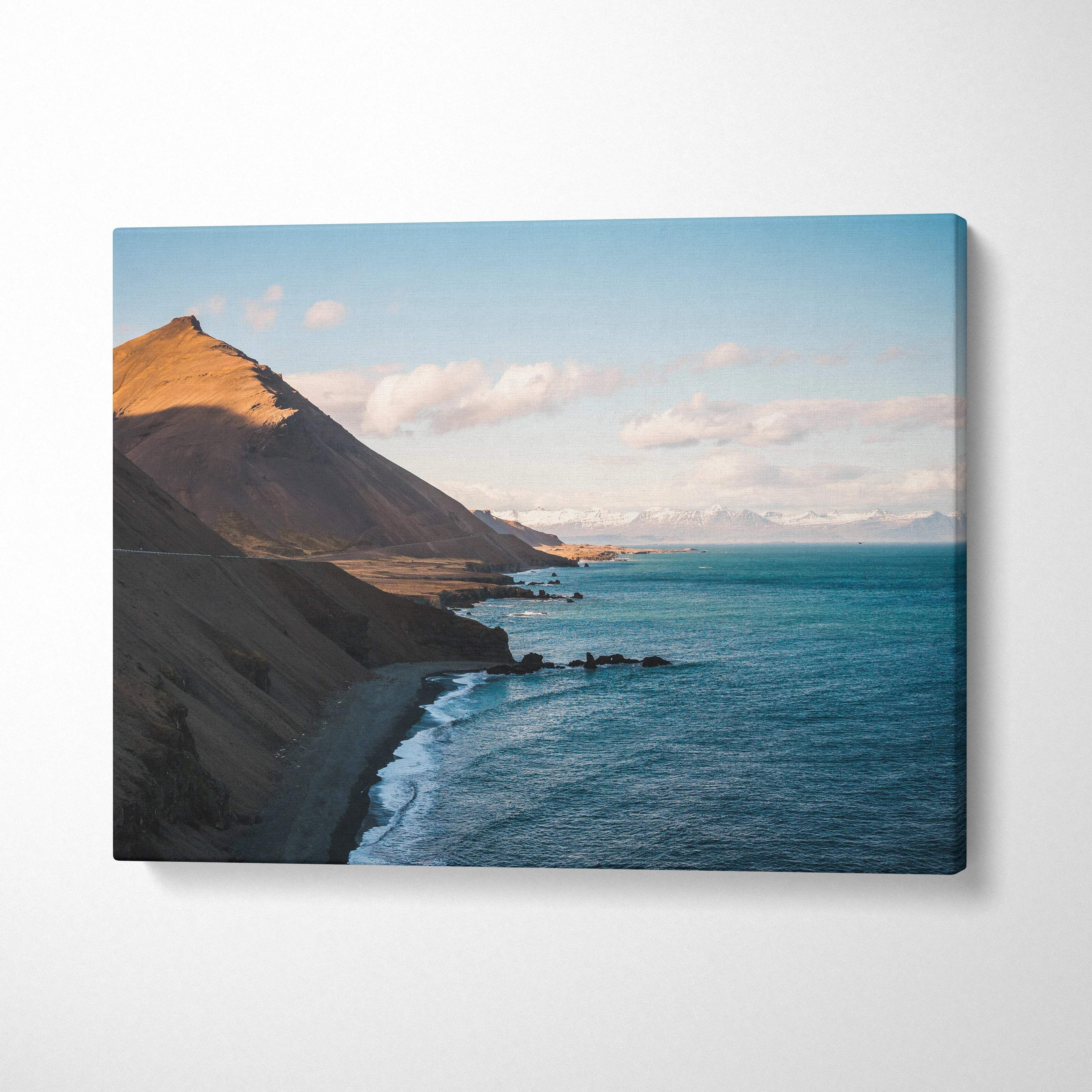 Canvas print of Iceland coastline with turquoise waters, golden cliffs, mountains