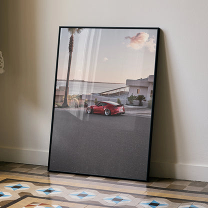 Nissan 370z parked on coastal road poster wall art with palm trees and pastel sky.