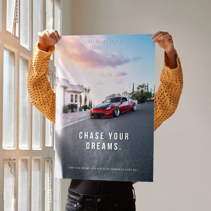 Motivational wall art poster featuring red Nissan 370z on scenic road with "Chase Your Dreams" text.