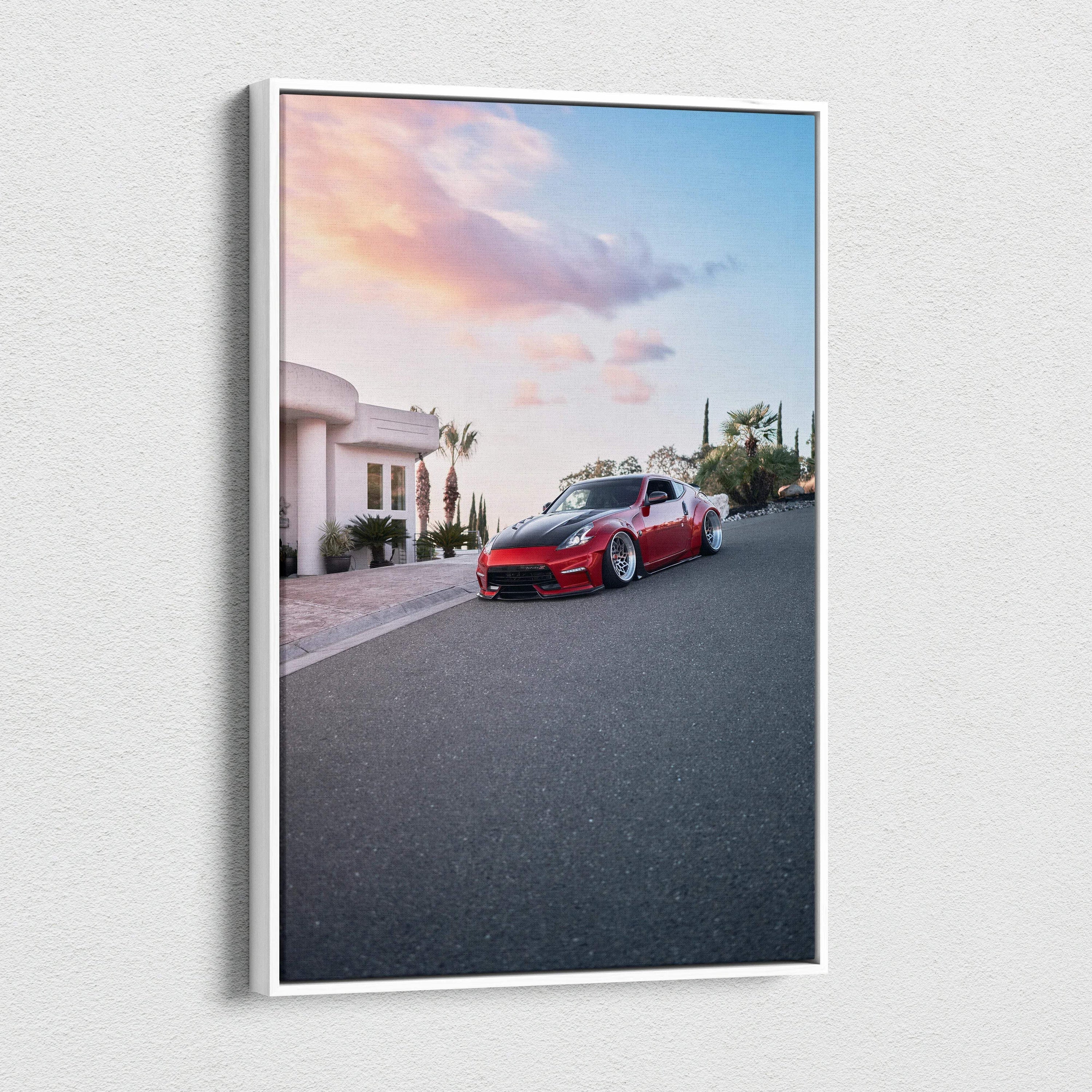 Red Nissan 370z parked on street with sunset sky canvas wall art print.