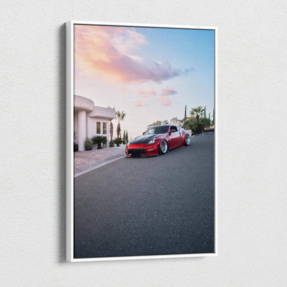 Red Nissan 370z parked on street with sunset sky canvas wall art print.