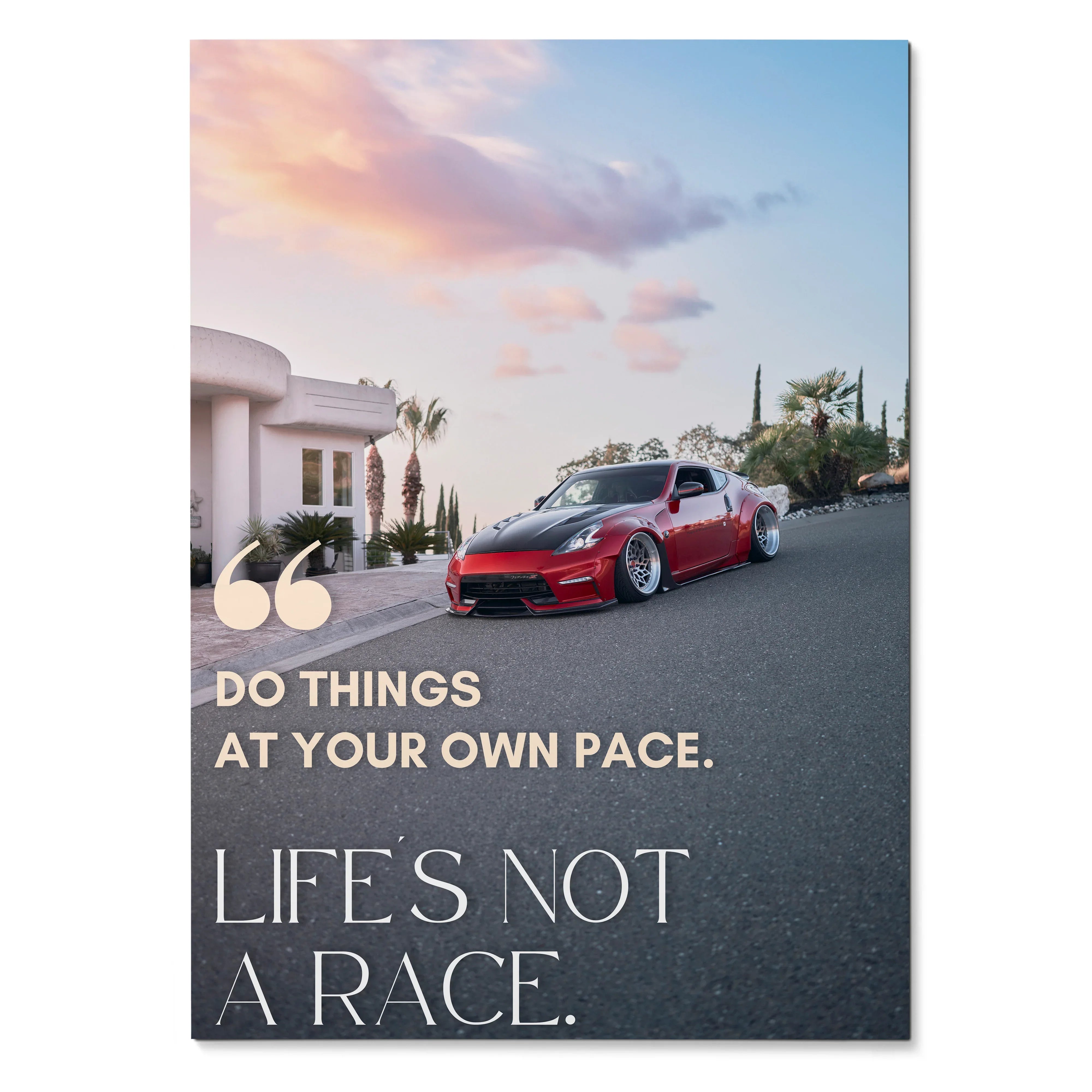 Motivational poster wall art featuring red Nissan 370z on road with sunset sky and inspiring text.