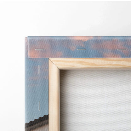 Close-up of wooden frame corner and stapled canvas with sunset colors on vertical wall art canvas panel.