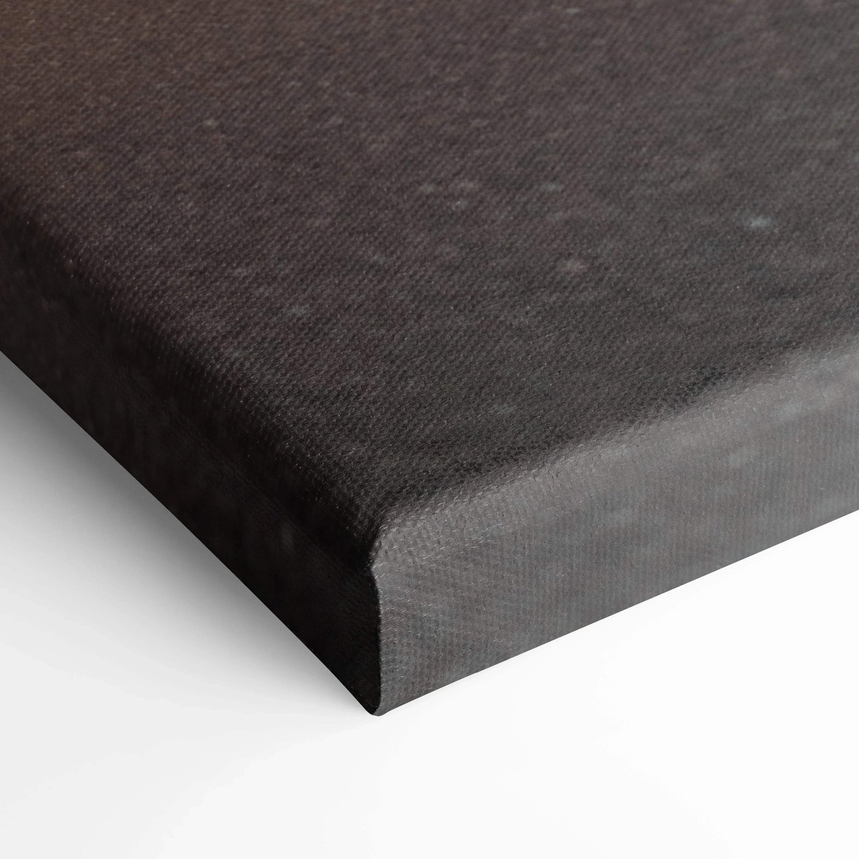 Close-up of black textured canvas stretched over wooden frame for wall art.