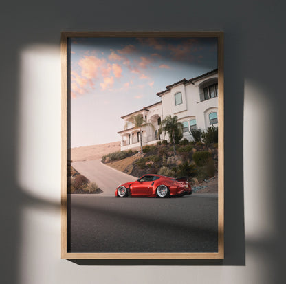 Nissan 370z red sports car parked on driveway at sunset poster wall art.