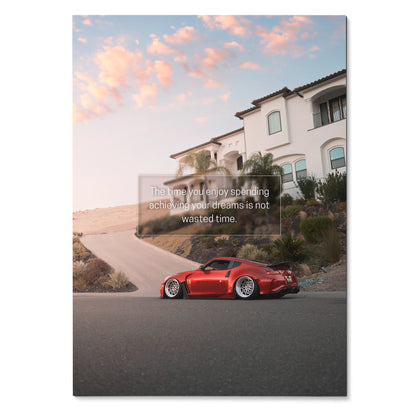 Nissan 370z red sports car parked on curved road with motivational quote poster wall art.
