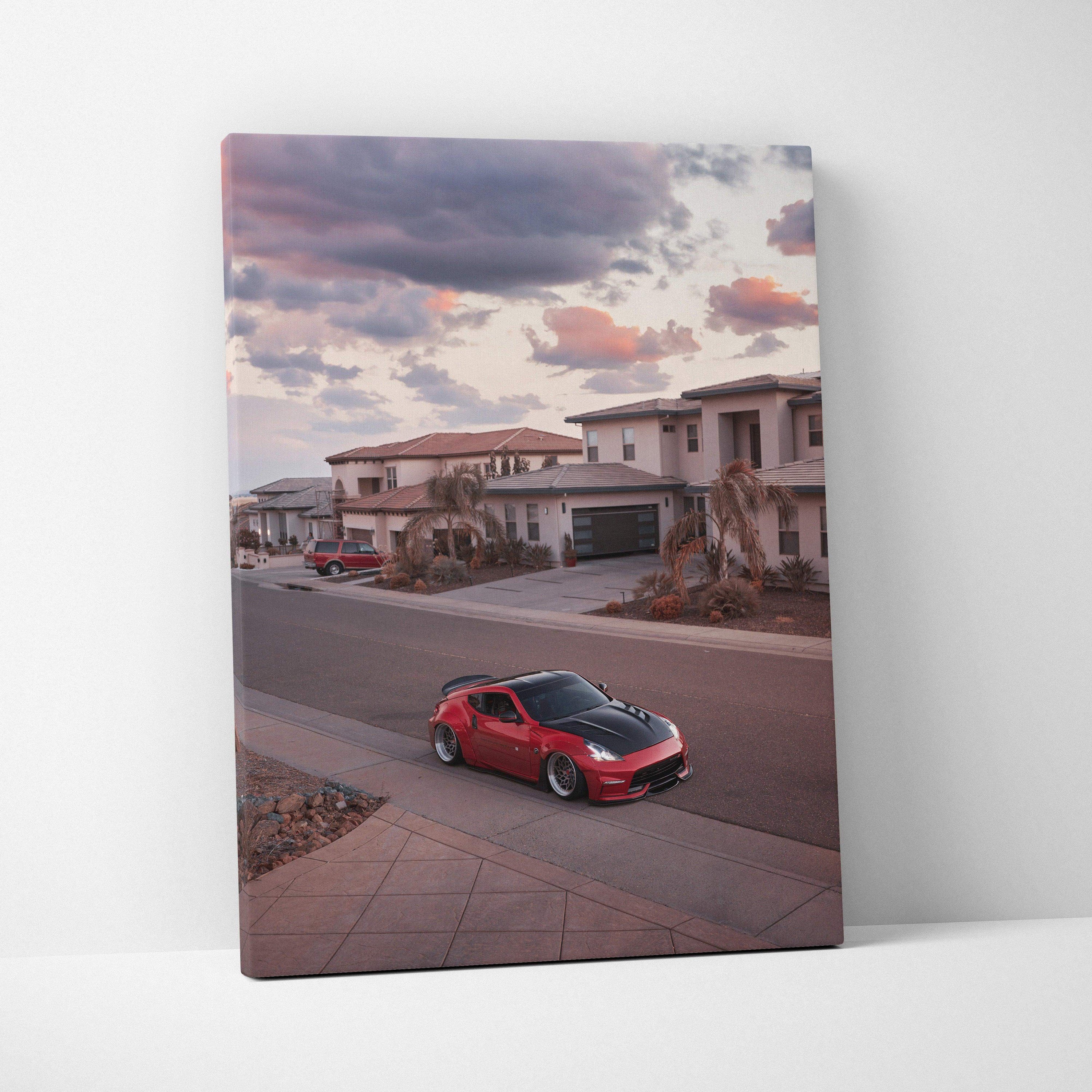 Red Nissan 370z parked on suburban street during sunset canvas wall art print.
