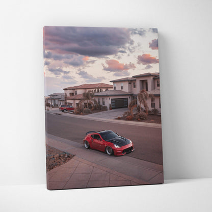 Red Nissan 370z parked on suburban street during sunset canvas wall art print.
