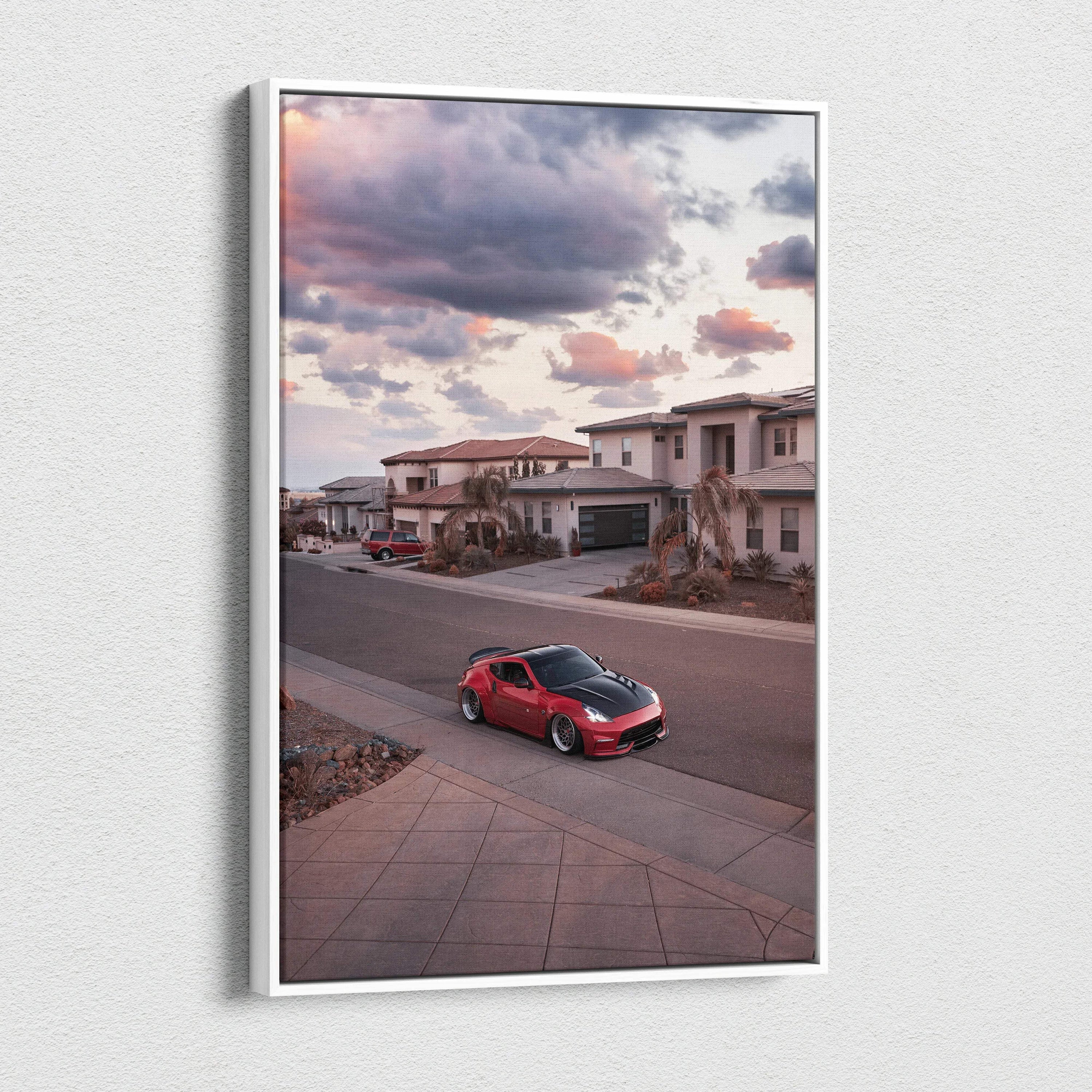 Red Nissan 370z parked on suburban street under colorful sunset sky vertical canvas wall art.