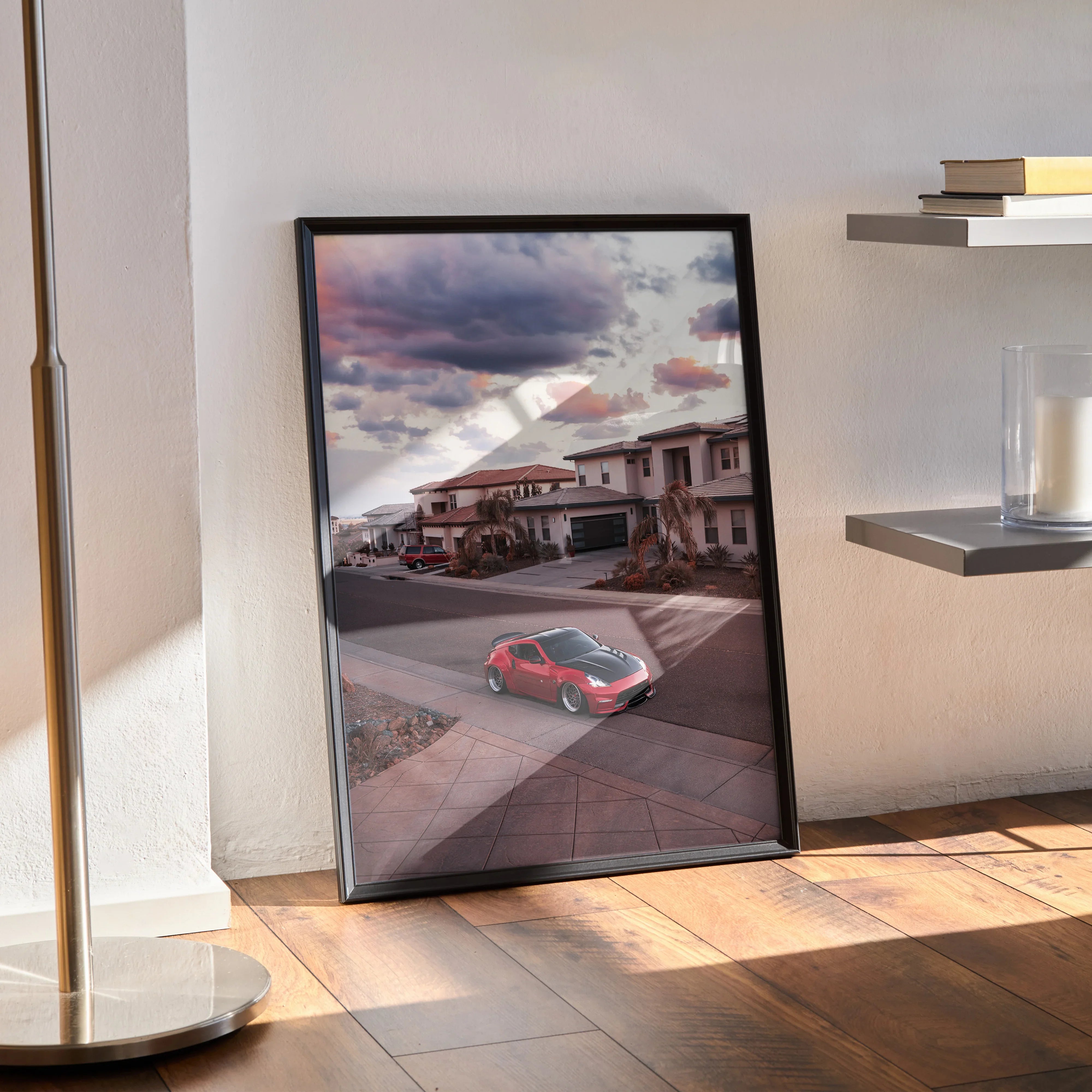 Nissan 370z poster with sunset sky and suburban street, sleek red sports car wall art in black frame.