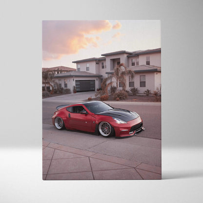 Red Nissan 370z sports car parked in front of modern houses canvas wall art print.