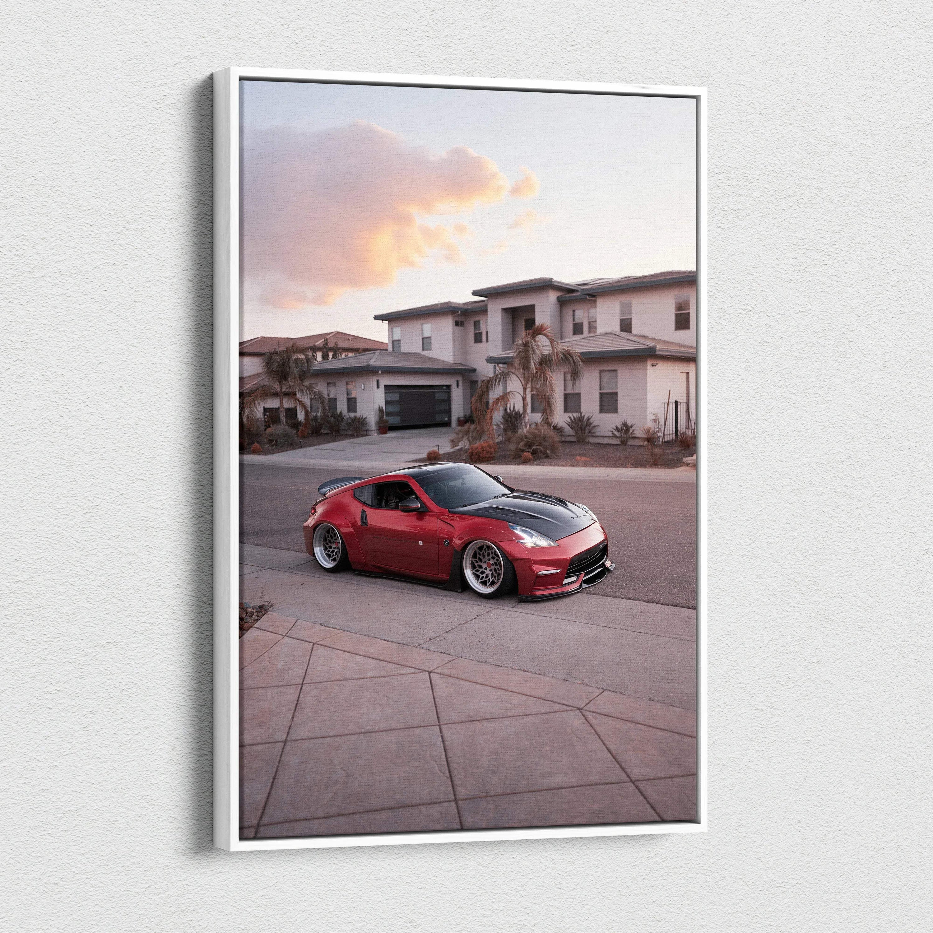 Vertical canvas wall art featuring a red Nissan 370z parked in a suburban neighborhood at sunset.
