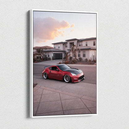 Vertical canvas wall art featuring a red Nissan 370z parked in a suburban neighborhood at sunset.